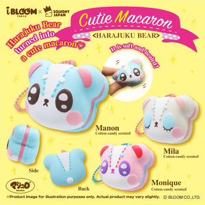 Harajuku Bear Macarons that are Cotton Candy Scented on Display. Manon is at the top left in a Teal color with Pink Filling and Brown, Open Eyes. Mila is at the Top Right with Blue Eyelids that are closed and Pink Filling. Monique is a the bottom in a Pink Color, with Purple Open Eyes, and Blue filling.